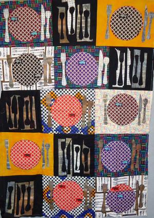 image of a quilt by Susan Callahan titled Pig Roast Family Fun
